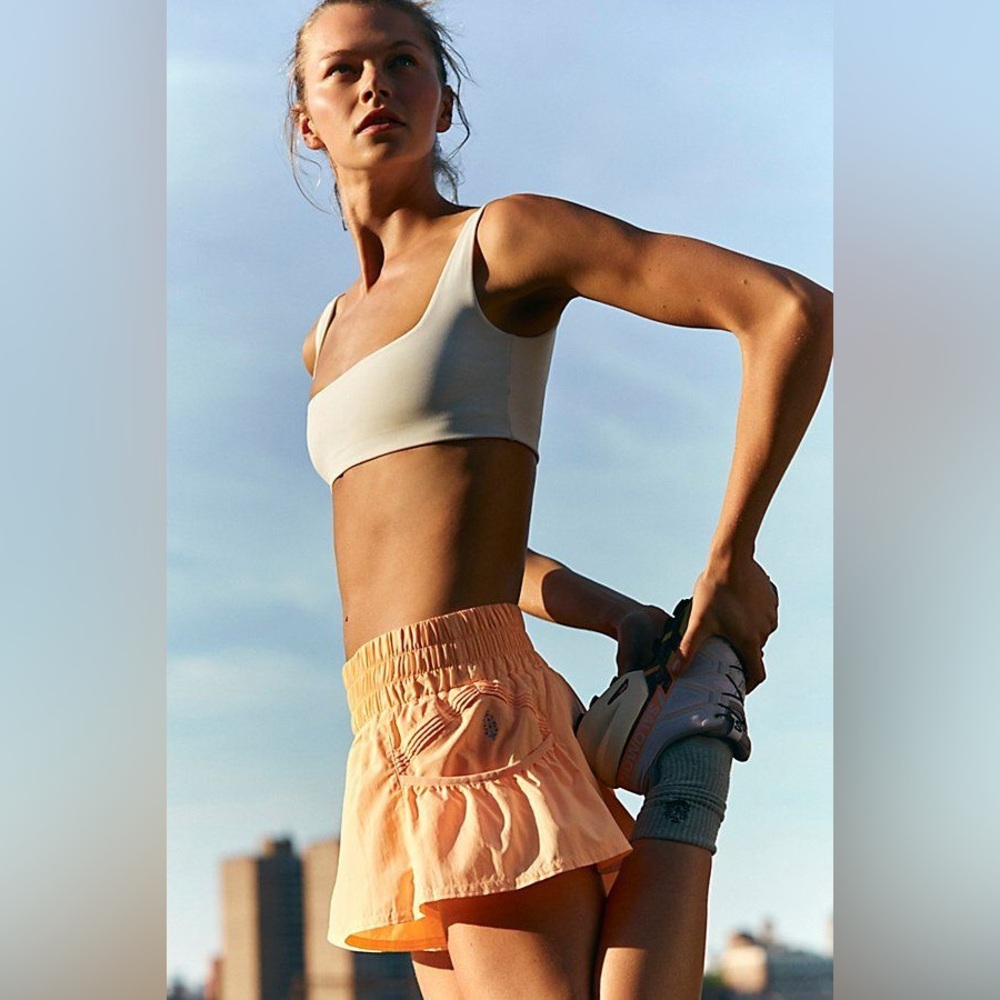 FP Movement by Free People Get Your Flirt On Shorts in color neon clementine